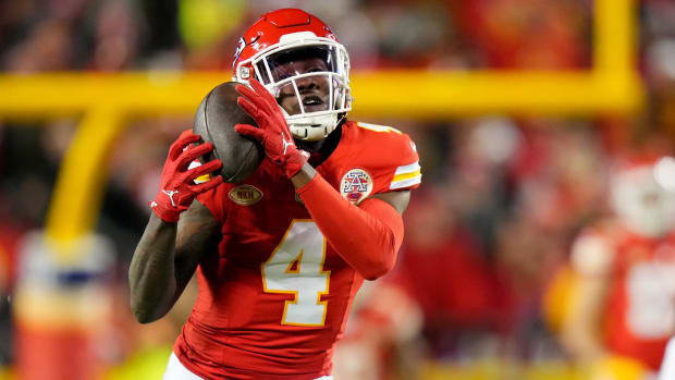 Kansas City Chiefs wide receiver Rashee Rice (4) catches a deep pass as Cincinnati Bengals cornerback Cam Taylor-Britt (29) defends in the third quarter during a Week 17 NFL football game between the Cincinnati Bengals and the Kansas City Chiefs, Sunday, Dec. 31, 2023, at GEHA Field at Arrowhead Stadium in Kansas City, Mo. The Kansas City Chiefs won, 25-17.  